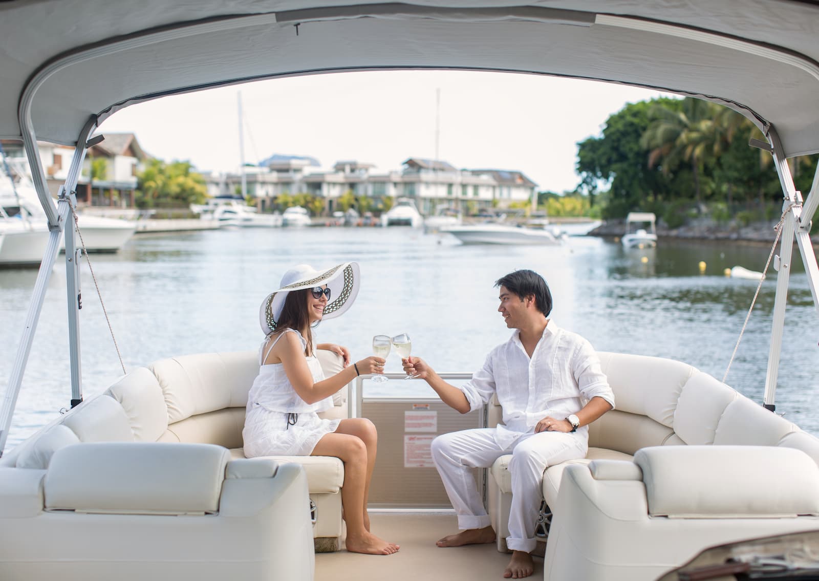 Man spraying champagne on boat